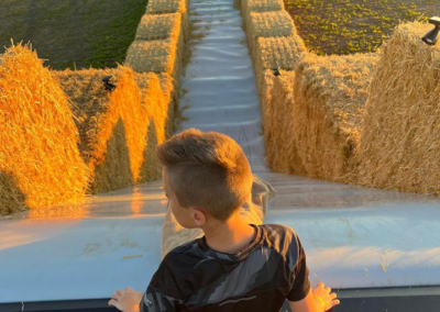 A kid at the top of the giant slide
