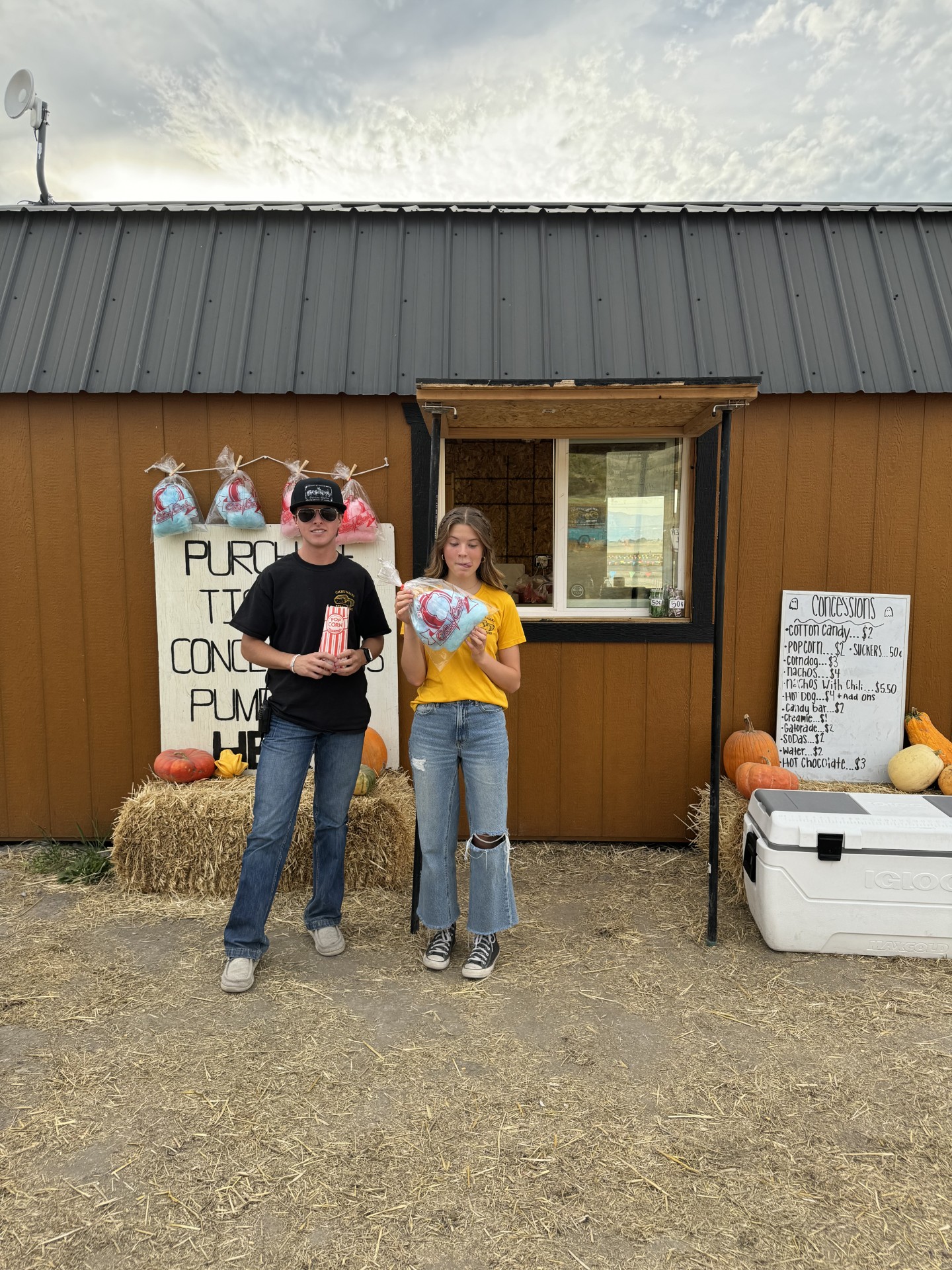 two teens or young adults at the concession stand